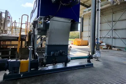 NEMO® BF Hopper Pump with aBP-Module® technology operating in an industrial wastewater facility, designed for efficient sludge cake transfer.