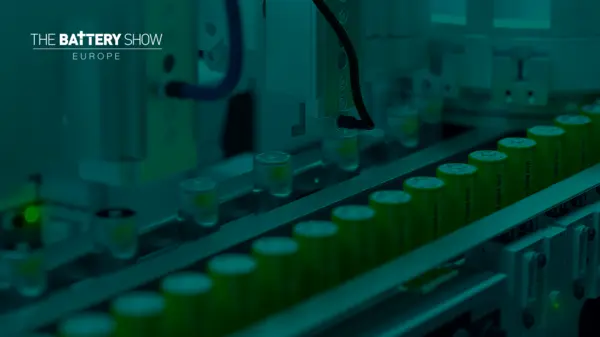 Green battery cells on a production line at The Battery Show Europe, showcasing advanced technology in battery manufacturing.