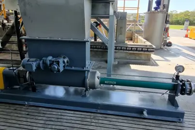 NEMO® BF Hopper Pump by NETZSCH with aBP-Module® technology for high-pressure sludge cake transfer in wastewater treatment.